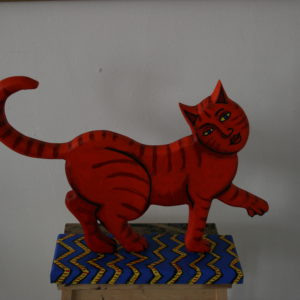 Red cat on blue rug